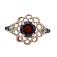 view of the ring focusing on the center garnet