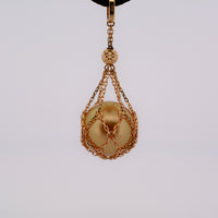 showing a gold south sea pearl in the gold net