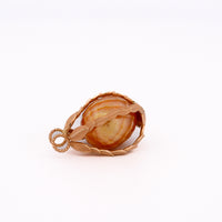 a golden south sea pearl held inside