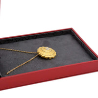 side view of the pendant inside its box