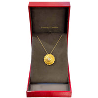a view of the pendant displayed in its carrera y carrera box