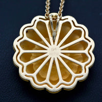 rear view of the pendant with the carrera y carrera hallmark and number