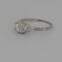 showing the engravings and a light reflection from the diamond