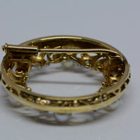 reverse side of the brooch showing the pin and clasp