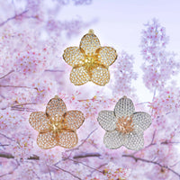 Showing our bespoke cherry blossom pendant in available finishes