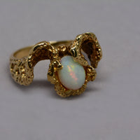 view of the opal and texture of the ring's band