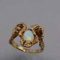 top view showing the opal's play of colour and the textured ring band