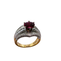 full view of the ring showing filigree and the two tone band