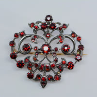 front view of the brooch showing old mine cut garnets