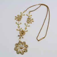 showing the necklace with attached center pendant