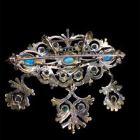 rear view of the brooch showing the pin and back of the setting