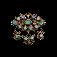 front view of the brooch showing the opals