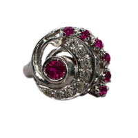 closeup of the face of the ring showing the swirl or volute motif