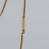 the clasp of the chain also showing the metal purity mark of 14 karat