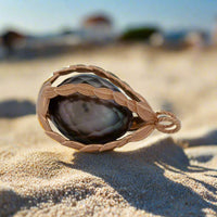 a tahitian pearl inside the myrtus pearl cage