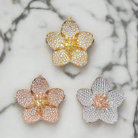 The cherry blossom pendants in different gold colours