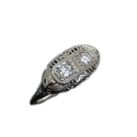 side angle view of the two main diamonds set in filigree