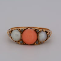 view of the ring face showing the coral and pearls