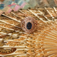 top view of the victoria ring on a decorative background