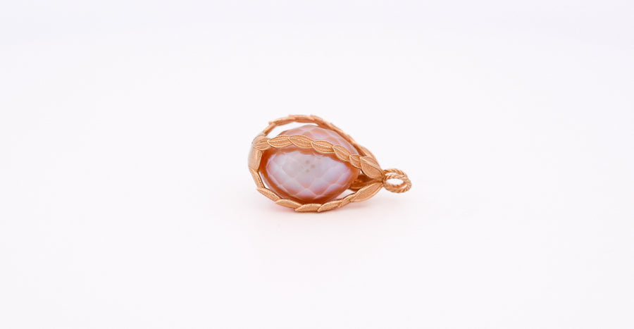a pink freshwater pearl held inside
