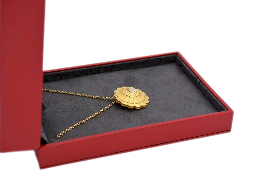 side view of the pendant inside its box