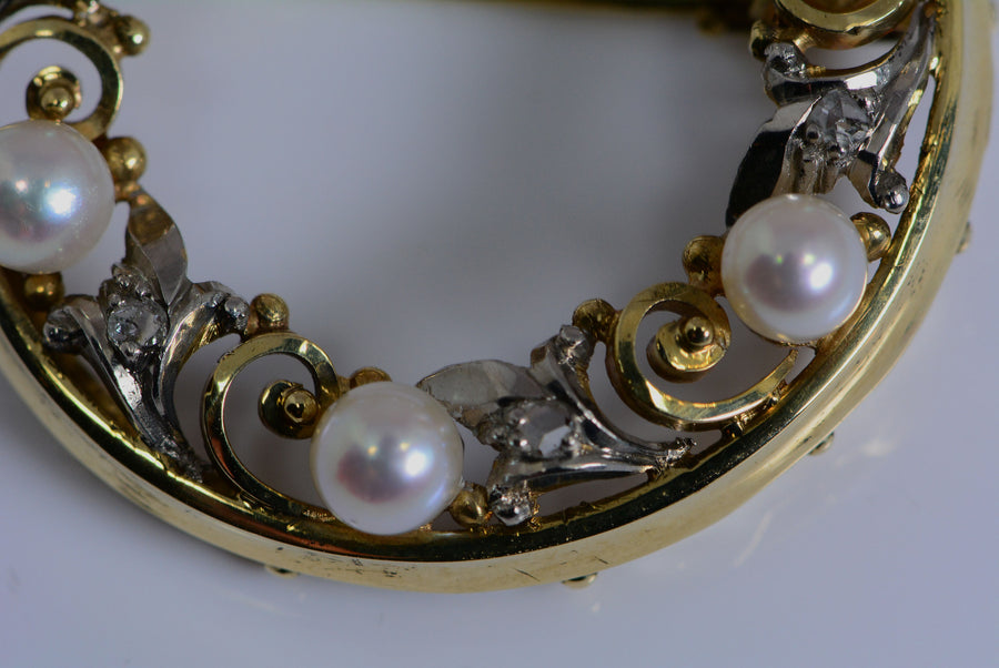 closeup of metal work, pearls, and diamonds
