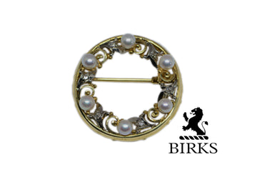 birks logo with the brooch