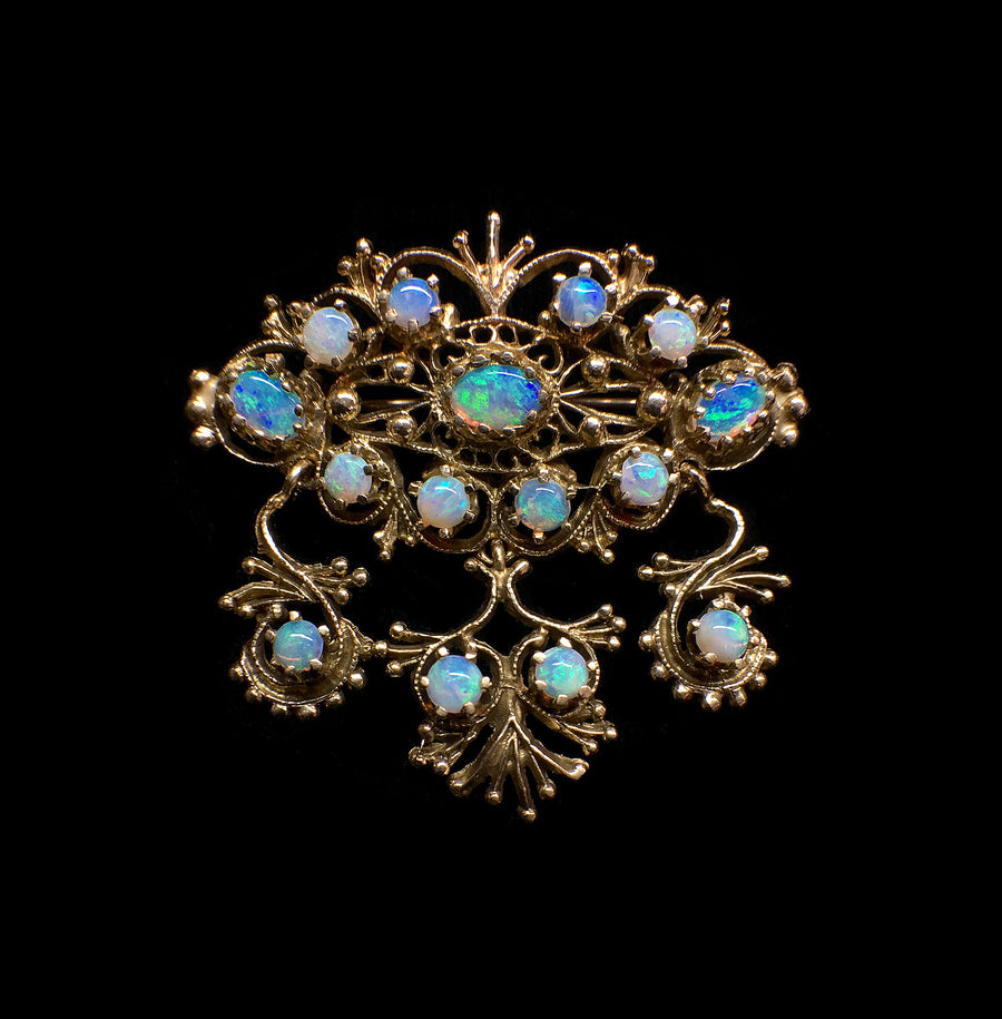 front view of the brooch showing the opals