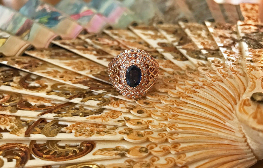 top view of the victoria ring on a decorative background